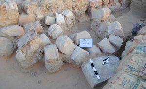 Inscripted block (lower right) as found in 'Ayn Gharandal gate area. Photo Darby 2013.