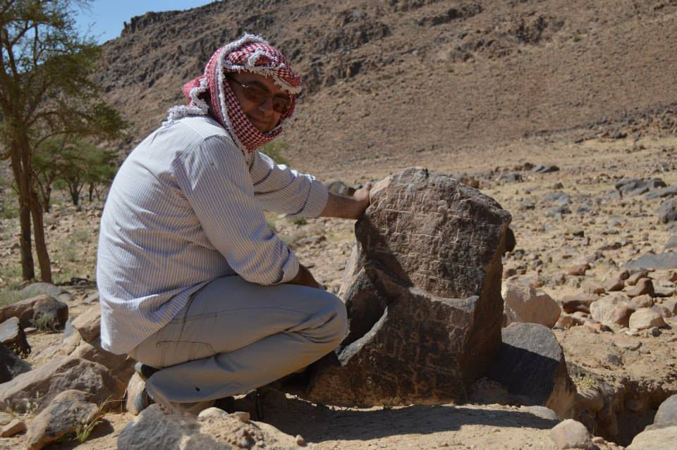 Firas Bqa'in observes Nabataean inscriptions