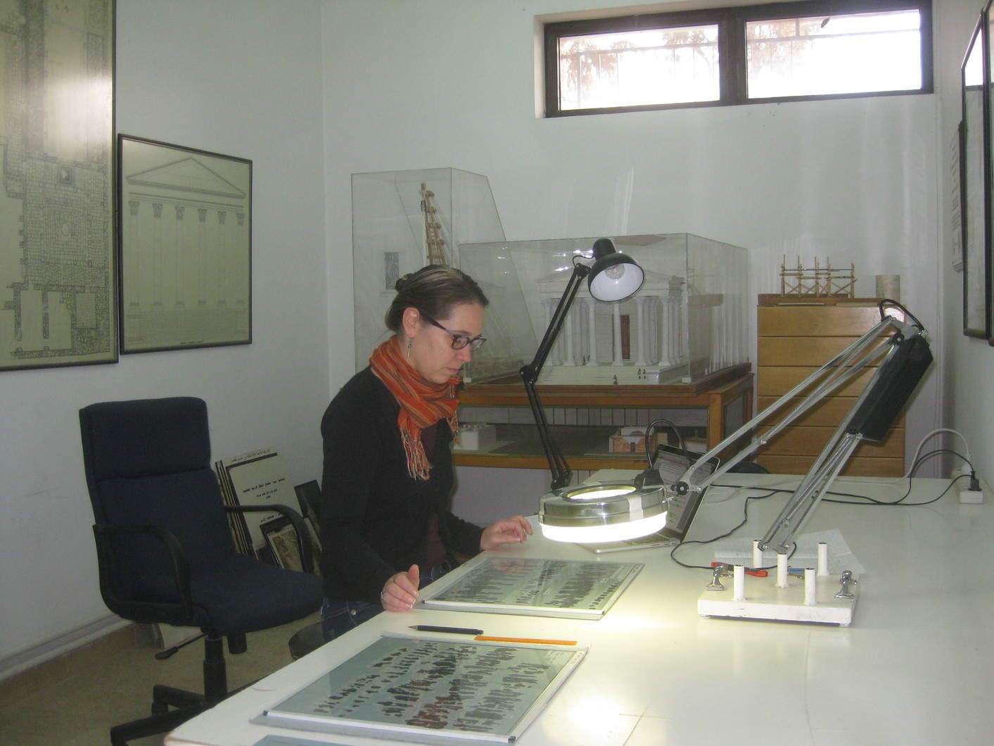 Papyrologists like Marja Vierros of the University of Helsinki (seen here studying the papyri at ACOR in December 2014) continue to analyze the papyri for information about daily affairs in Byzantine Petra. Photo by Barbara A. Porter.