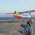 Chad Hill preparing to launch a fixed wing drone at Feifa, Jordan 2014 (Photo by Morag Kersel)