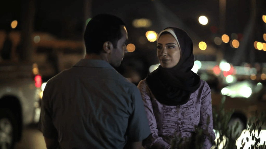  Hamdi and Monaliza sit at Abdoun Circle, a scene from the 2012 Jordanian film "When Monaliza Smiled"